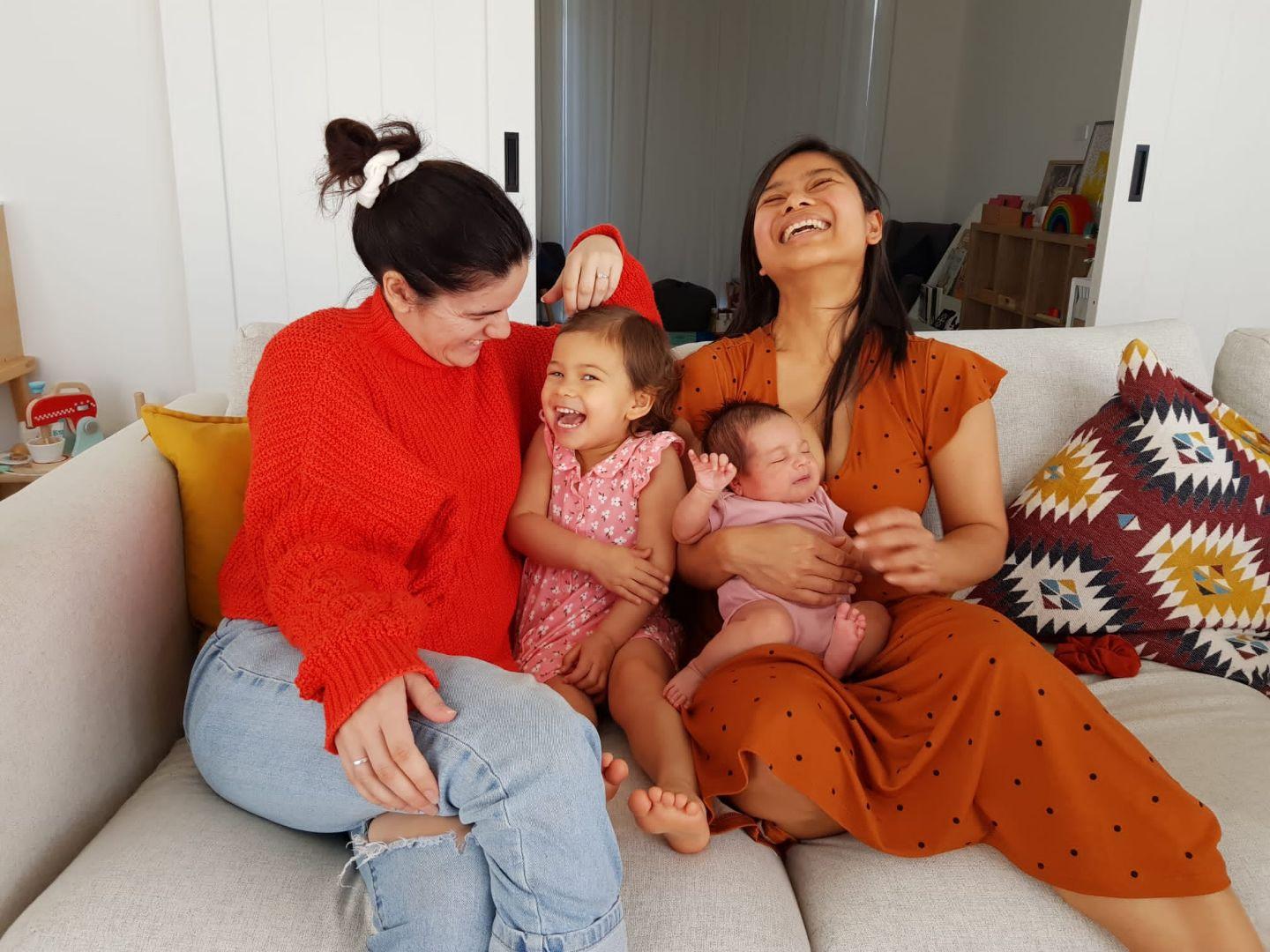 Family sitting on couch